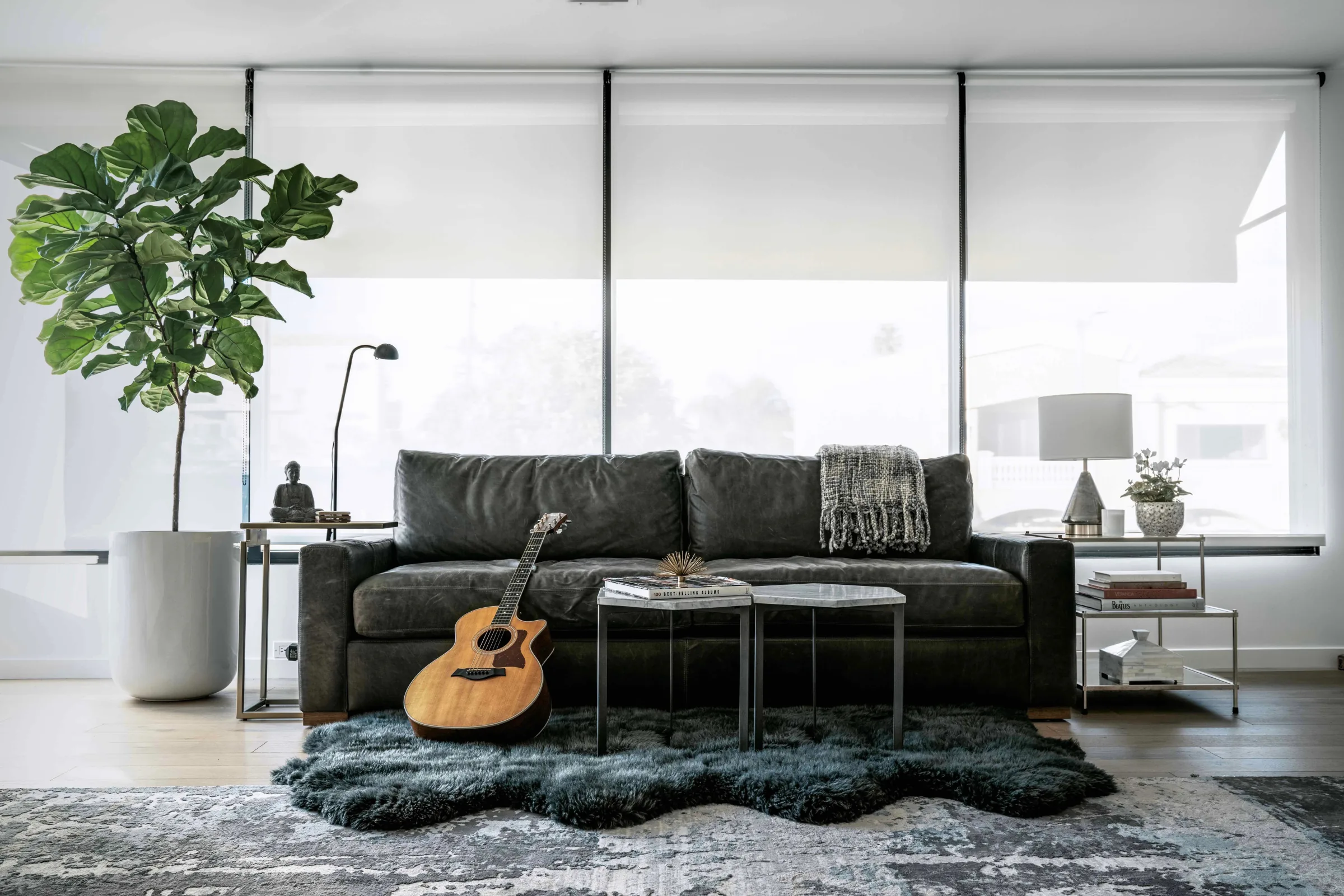 Guitar resting against a studio lounge sofa